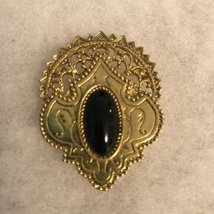 Gold tone brooch
